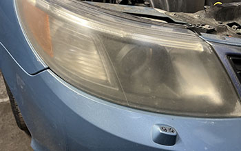 Exterior Services | Saab Headlight Before | Elite Imports & Auto Repair